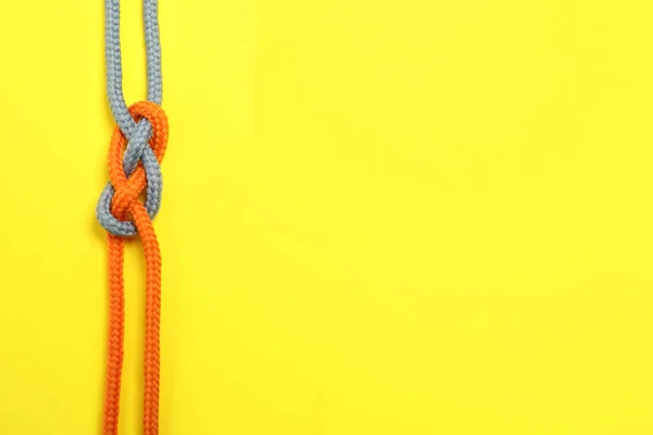 Top View Colorful Ropes Tied Together Yellow Background Space Text — Stock Photo, Image