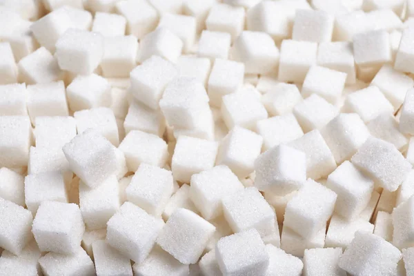 Vista de primer plano del azúcar refinado como fondo —  Fotos de Stock