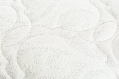 Arka plan olarak modern konforlu ortopedik yatak, yakın plan