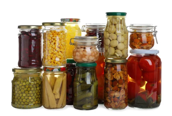 Glass jars of different pickled vegetables isolated on white — 스톡 사진