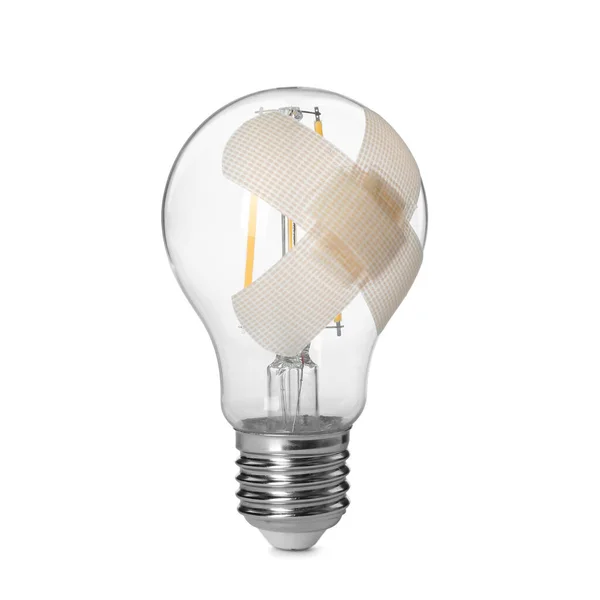 Glühbirne Mit Klebepflaster Isoliert Auf Weiß — Stockfoto