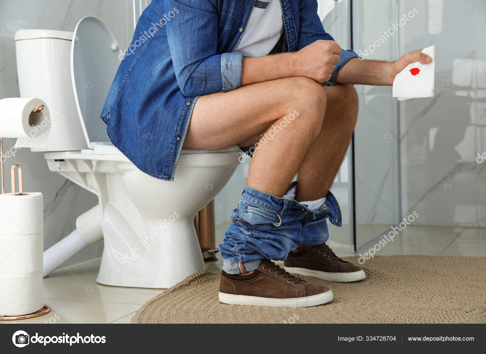 Man Holding Toilet Paper Blood Stain Rest Room Closeup Hemorrhoid Stock Photo by ©NewAfrica