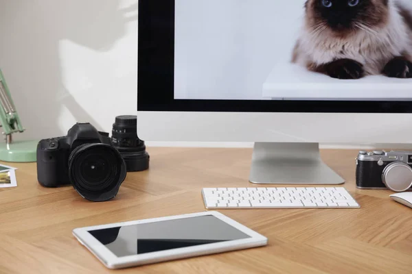 Photographer's workplace with professional camera in office — 스톡 사진