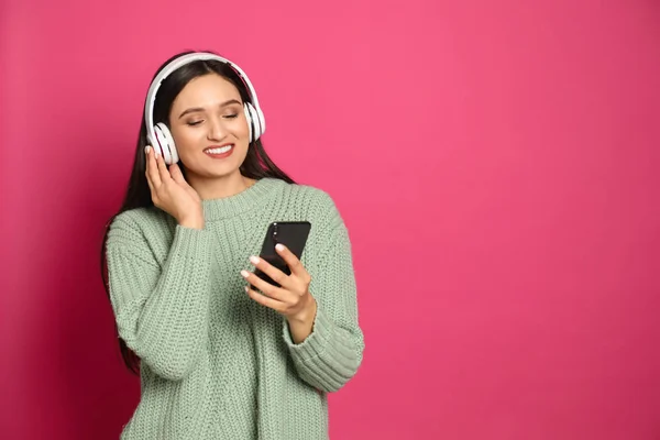Young Woman Listening Audiobook Pink Background Space Text — 스톡 사진