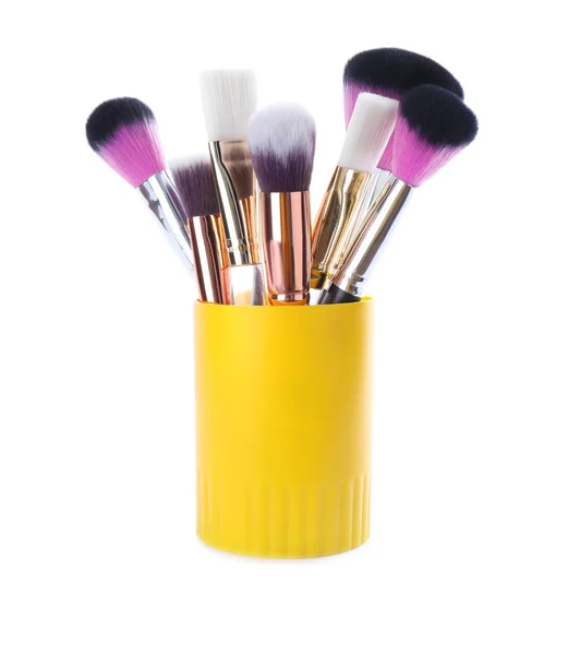 Set of professional makeup brushes in holder isolated on white — Stock Photo, Image
