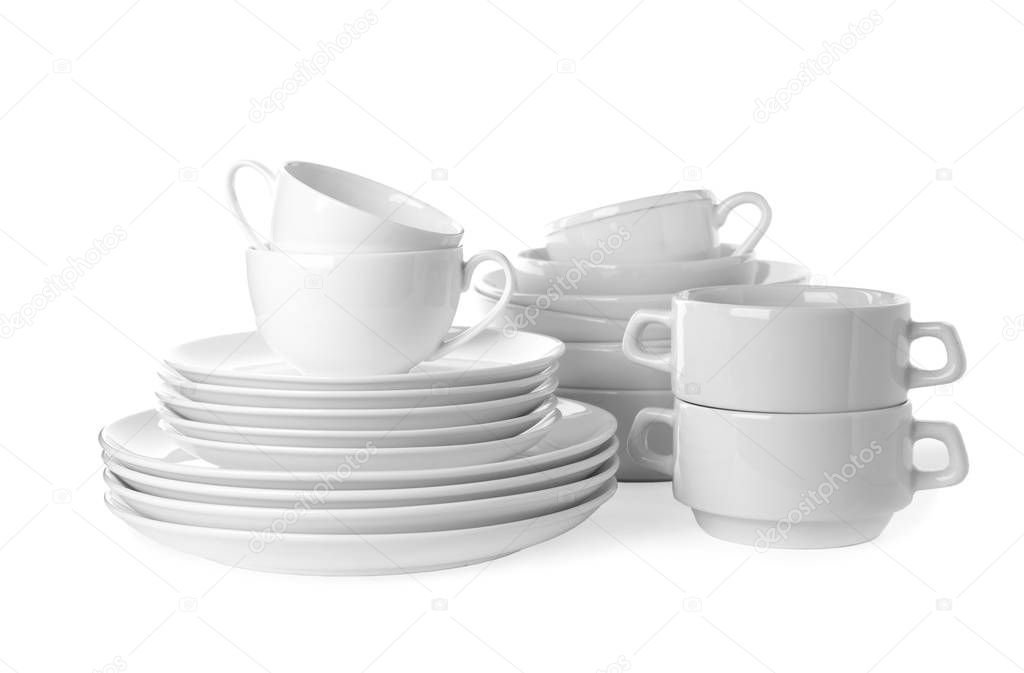 Set of clean tableware isolated on white