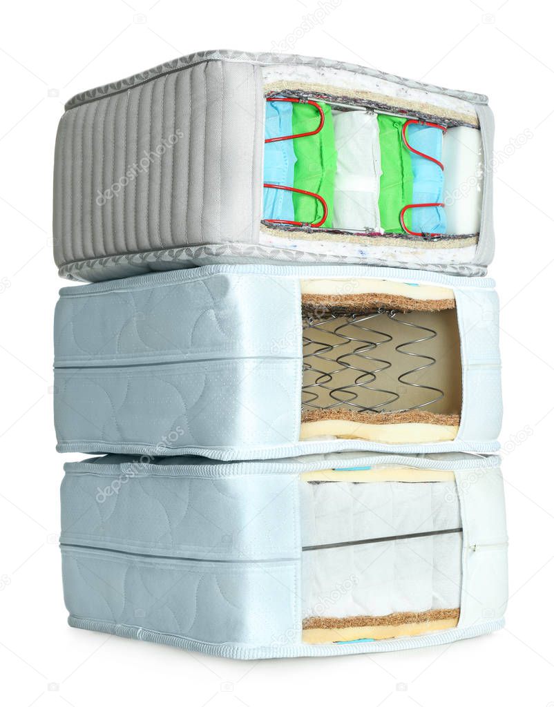 Samples of modern orthopedic mattress on white background