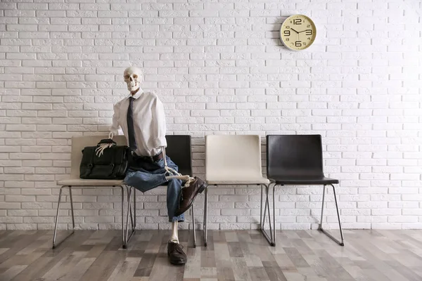 Human Skeleton Office Wear Sitting Chair Brick Wall Indoors — 스톡 사진