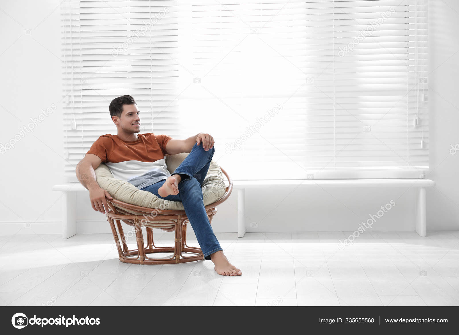 Person sitting in papasan chair clearance