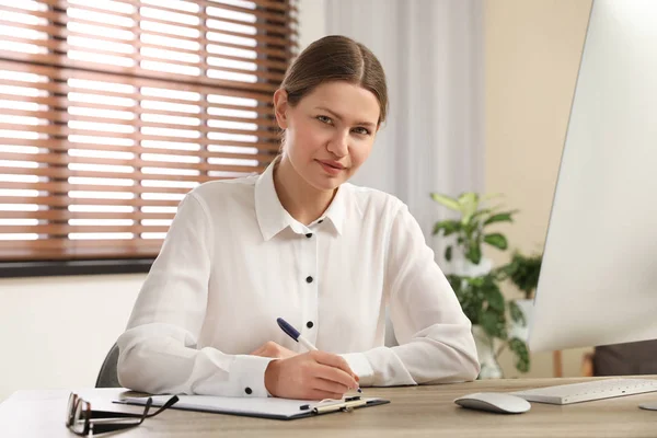 Professional psychotherapist at table in modern office — Stock Photo, Image