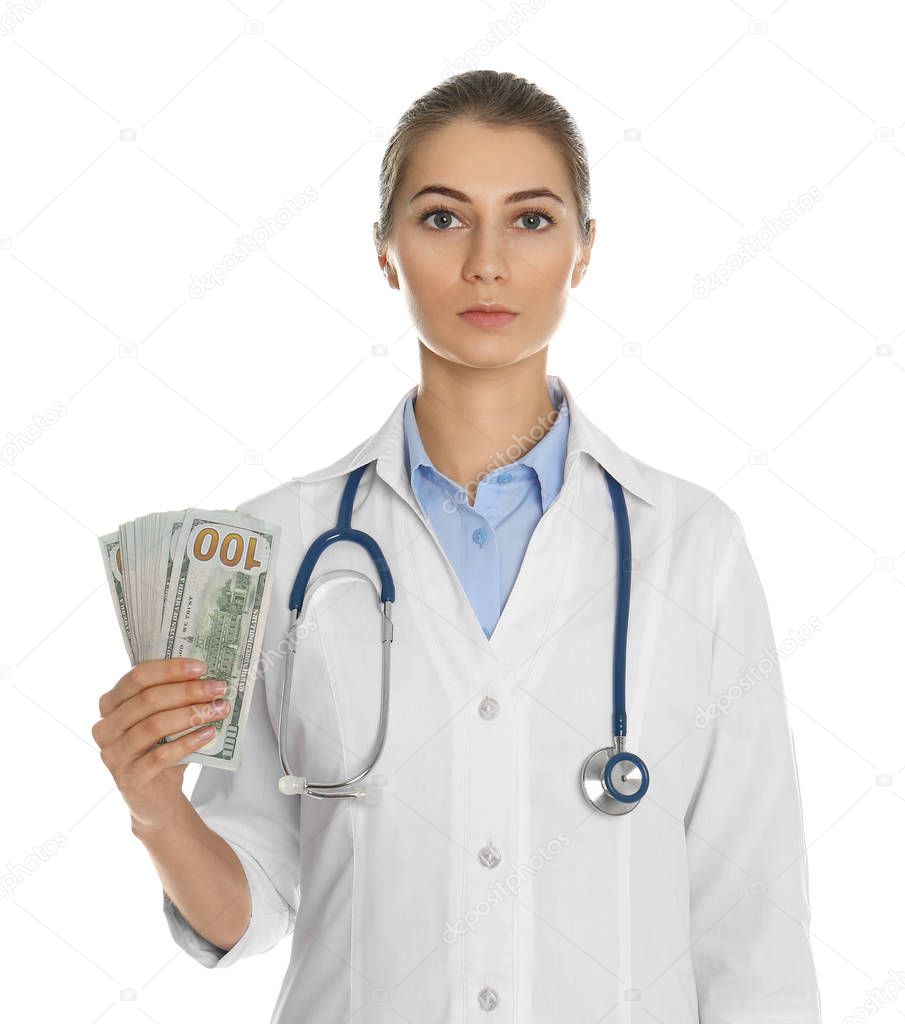 Doctor with bribe on white background. Corruption in medicine