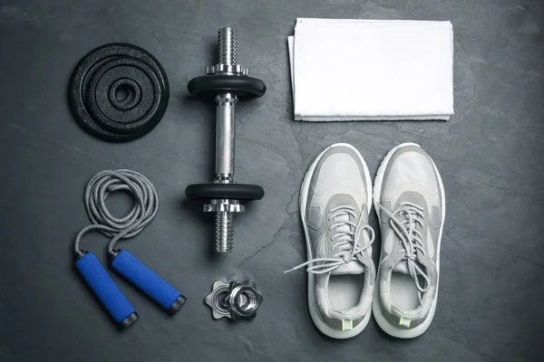 Gym equipment on black background, flat lay — Stock Photo, Image