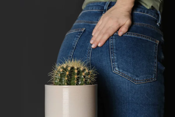 Woman Sitting Cactus Black Background Closeup Hemorrhoid Concept — Stock Photo, Image
