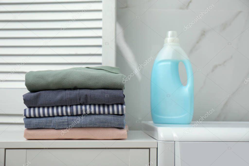 Fresh clean laundry and detergent in bathroom