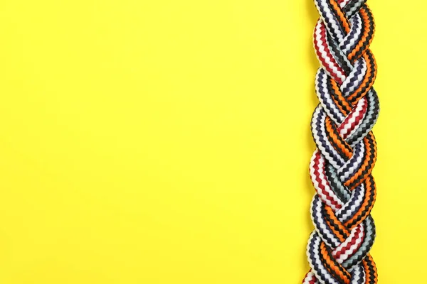 Top View Braided Colorful Ropes Yellow Background Space Text Unity — Stock Photo, Image