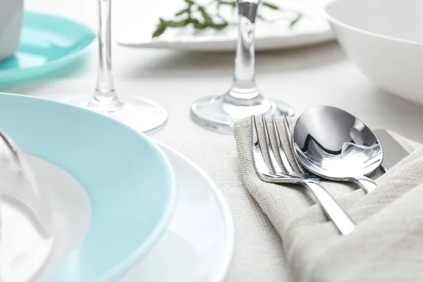 Elegant cutlery with green leaves on table, closeup. Festive set — Stock Photo, Image