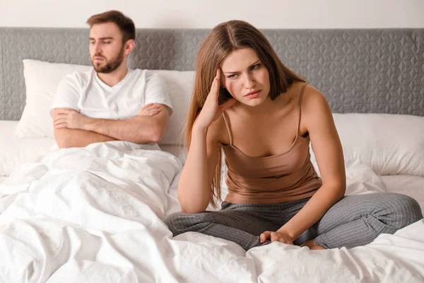 Unhappy couple with relationship problems after quarrel in bedro — Stock Photo, Image