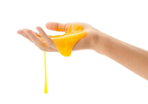 Woman playing with yellow slime isolated on white, closeup. Anti — 스톡 사진