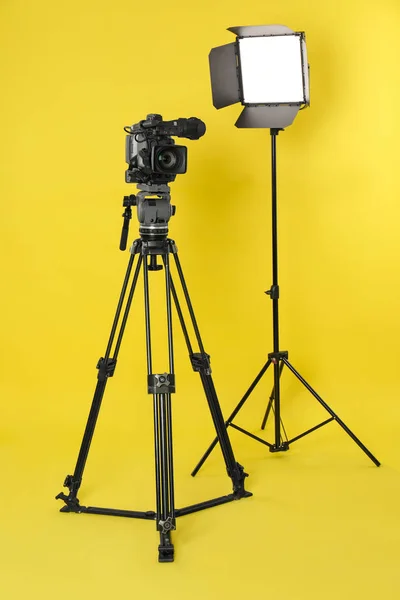 Professional Video Camera Lighting Equipment Yellow Background — 스톡 사진