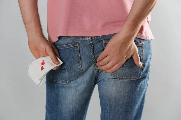 Man Holding Toilet Paper Blood Stain Light Grey Background Closeup — ストック写真