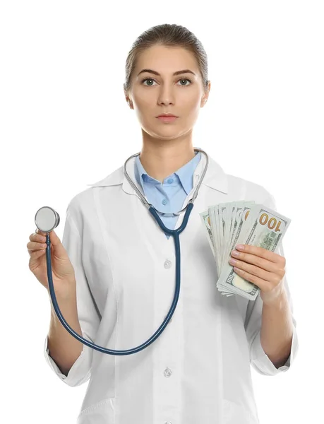 Doctor with bribe on white background. Corruption in medicine — Stock Photo, Image