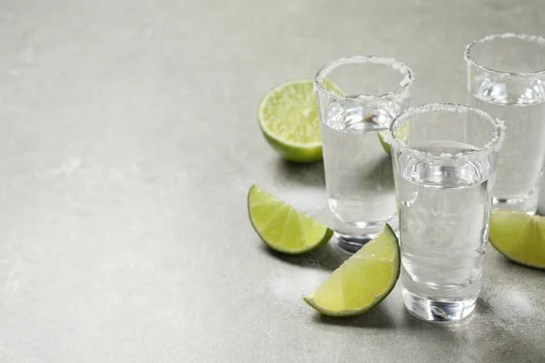 Mexican Tequila Shots Salt Lime Slices Grey Table Space Text — Stock Photo, Image