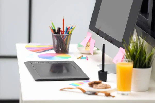 Modern designer\'s workplace with graphic tablet and computer