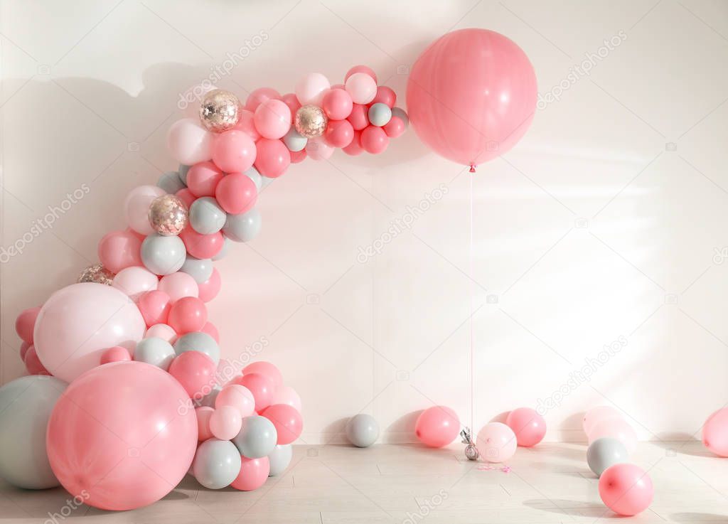 Room decorated with colorful balloons for party