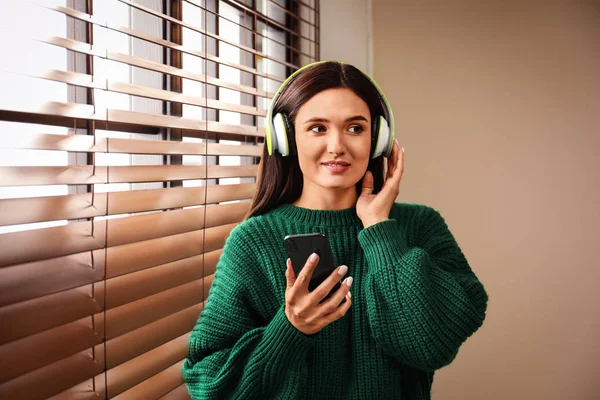 Young Woman Listening Audiobook Window Indoors — 스톡 사진