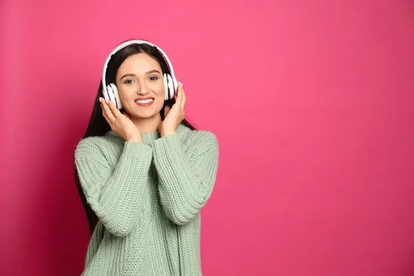 Young Woman Listening Audiobook Pink Background Space Text — 스톡 사진
