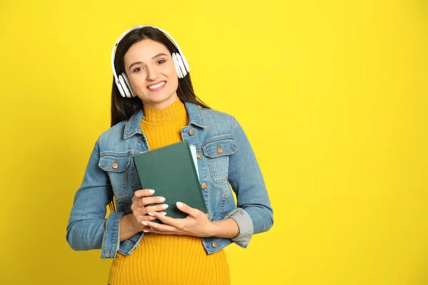 Young Woman Listening Audiobook Yellow Background Space Text — 스톡 사진