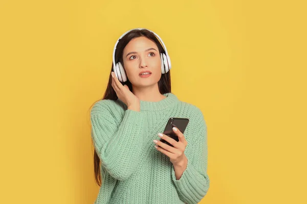 Young Woman Listening Audiobook Yellow Background — 스톡 사진