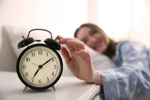 Young Woman Turning Alarm Clock Home Morning Focus Hand — Stock Photo, Image