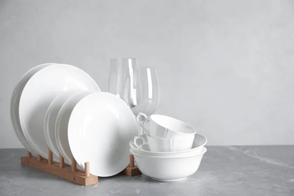 Set of clean dishware on marble table — ストック写真