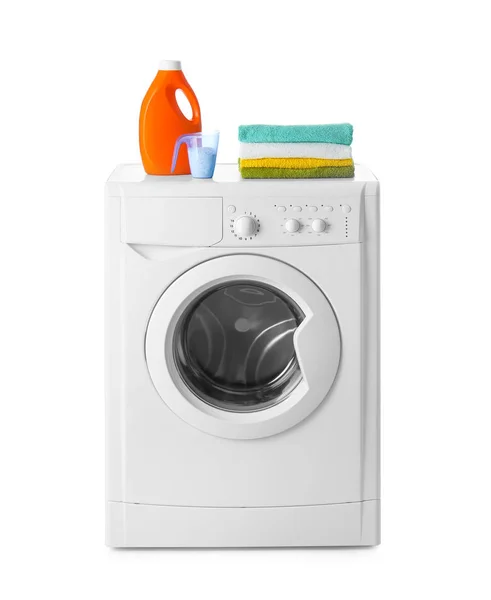 Modern washing machine, stack of towels and detergents on white — Stock Photo, Image