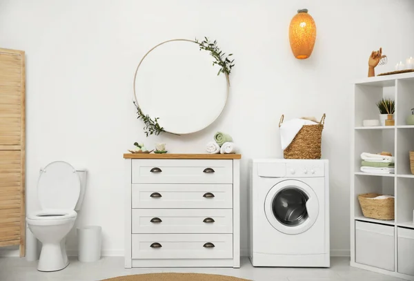 Interior of stylish bathroom with washing machine — Stock Photo, Image