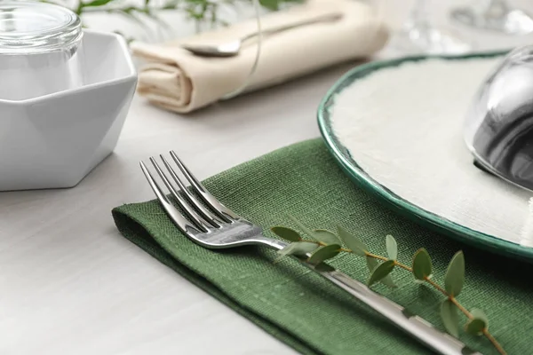 Stylish clean fork with leaves on white table, closeup. Festive — 스톡 사진