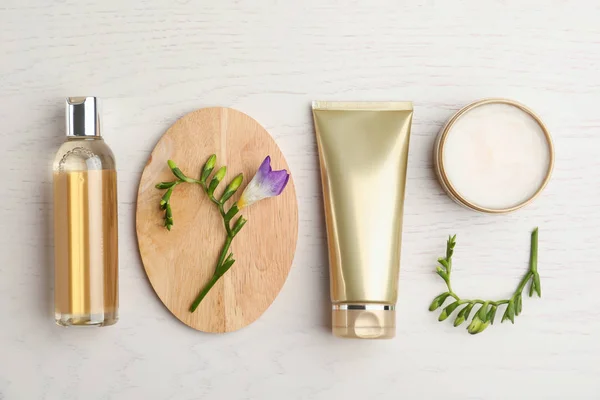 Flat lay composition with cosmetic products on white wooden tabl — ストック写真