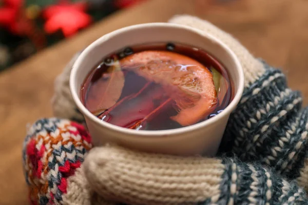 Woman with cup of mulled wine at counter, closeup — 스톡 사진