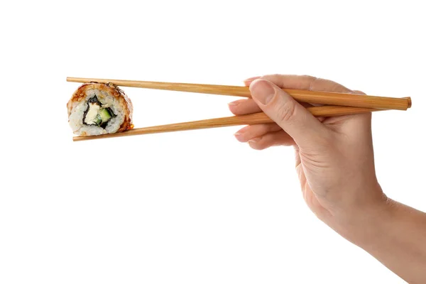 白い背景に寿司ロールを持つ女性,クローズアップ — ストック写真