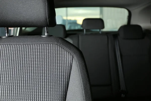 Car seat with grey upholstery, closeup view