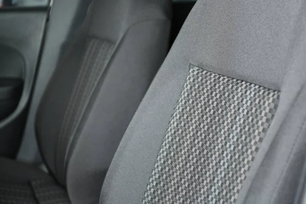 Car seat with grey upholstery, closeup view