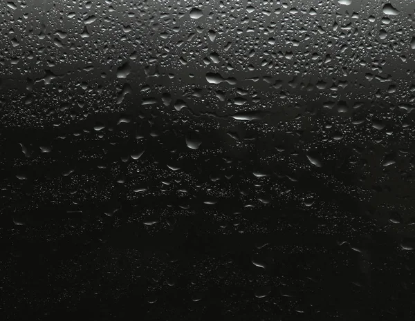 Siyah Arkaplan Üzerine Yağmur Damlaları — Stok fotoğraf