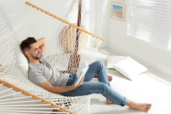 Young Man Reading Book Hammock Home — 스톡 사진