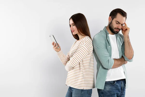 Woman Smartphone Ignoring Her Boyfriend Light Background Relationship Problems — Stockfoto