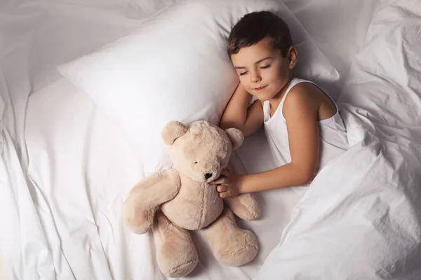 Little boy sleeping with teddy bear at home. Bedtime — 스톡 사진