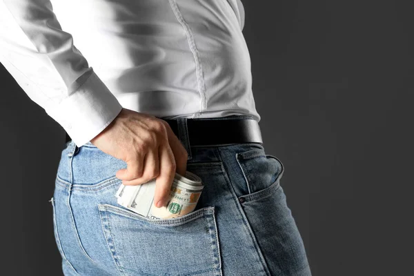 Man Putting Bribe Money Pocket Black Background Closeup — Stock Photo, Image