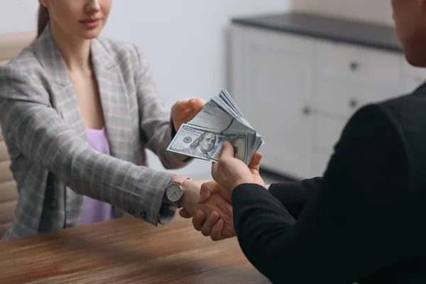 Man Shaking Hands Woman Offering Bribe Table Indoors Closeup — Stock Photo, Image
