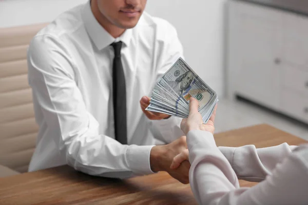 Woman Shaking Hands Man Offering Bribe Table Indoors Closeup — ストック写真