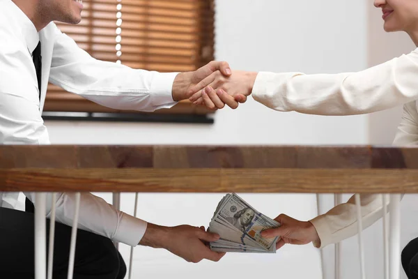 Woman Shaking Hands Man Giving Bribe Table Office Closeup — Stok fotoğraf